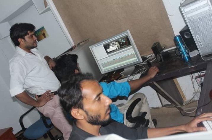 In an edit suite or control room, photo 2